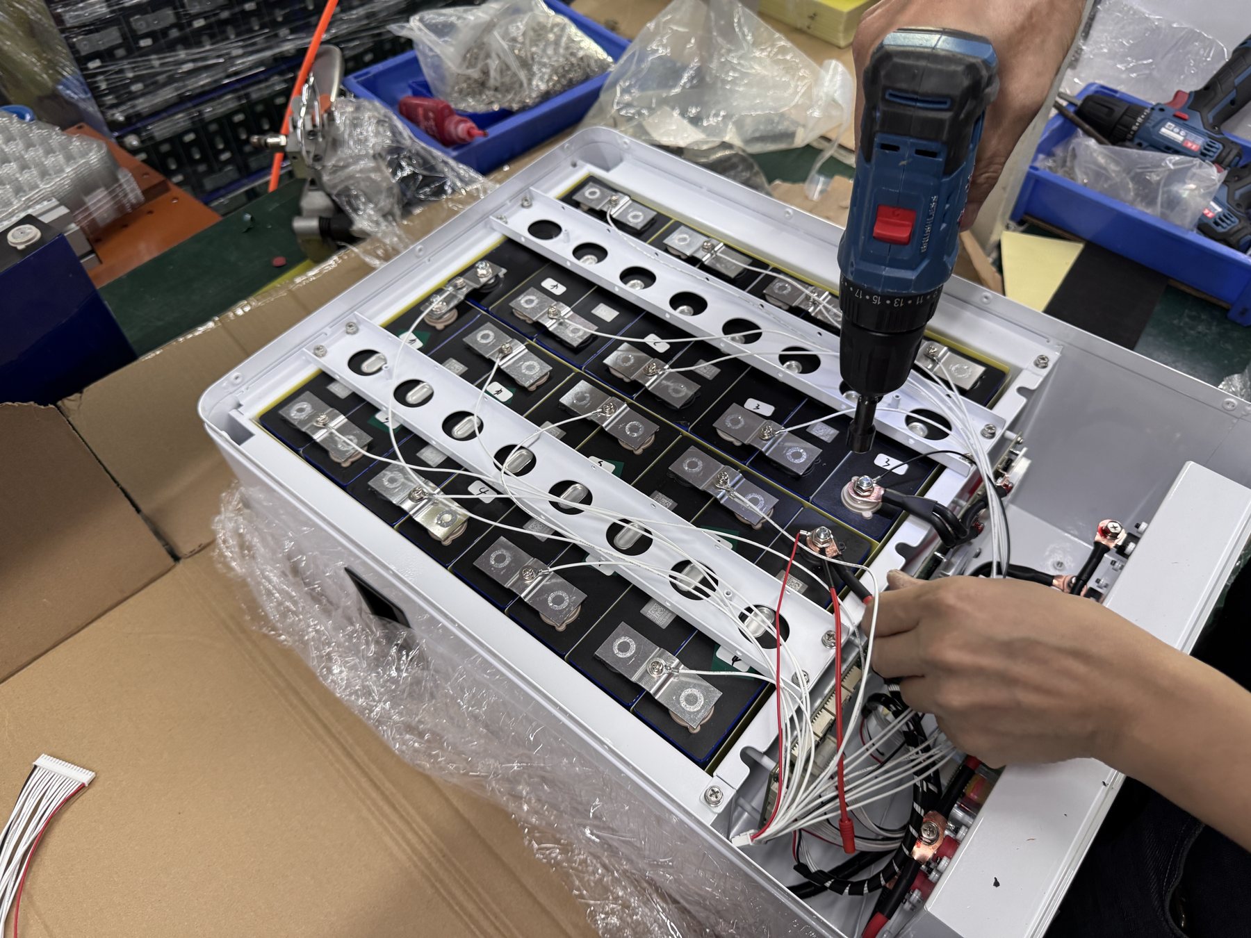 ZHGPOWER technicians assembling an industrial battery pack