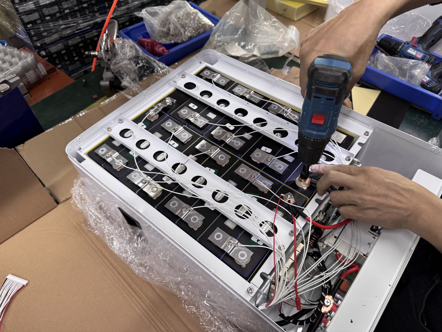Technician working on battery connections